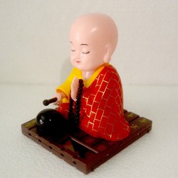 Tượng phật gõ mỏ tụng kinh 1